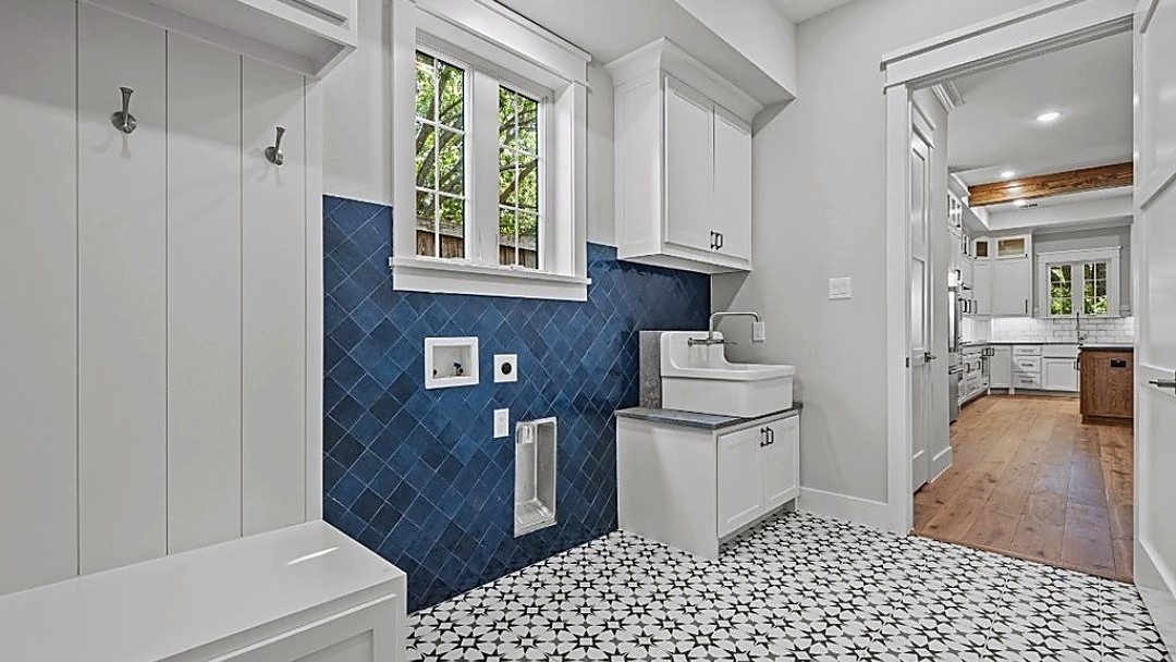 Oak Street mudroom with blue tile and patterned floor
