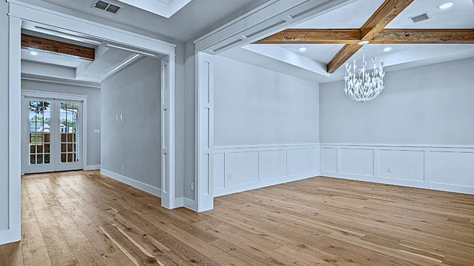 Oak Street dining room with coffered beams and chandelier