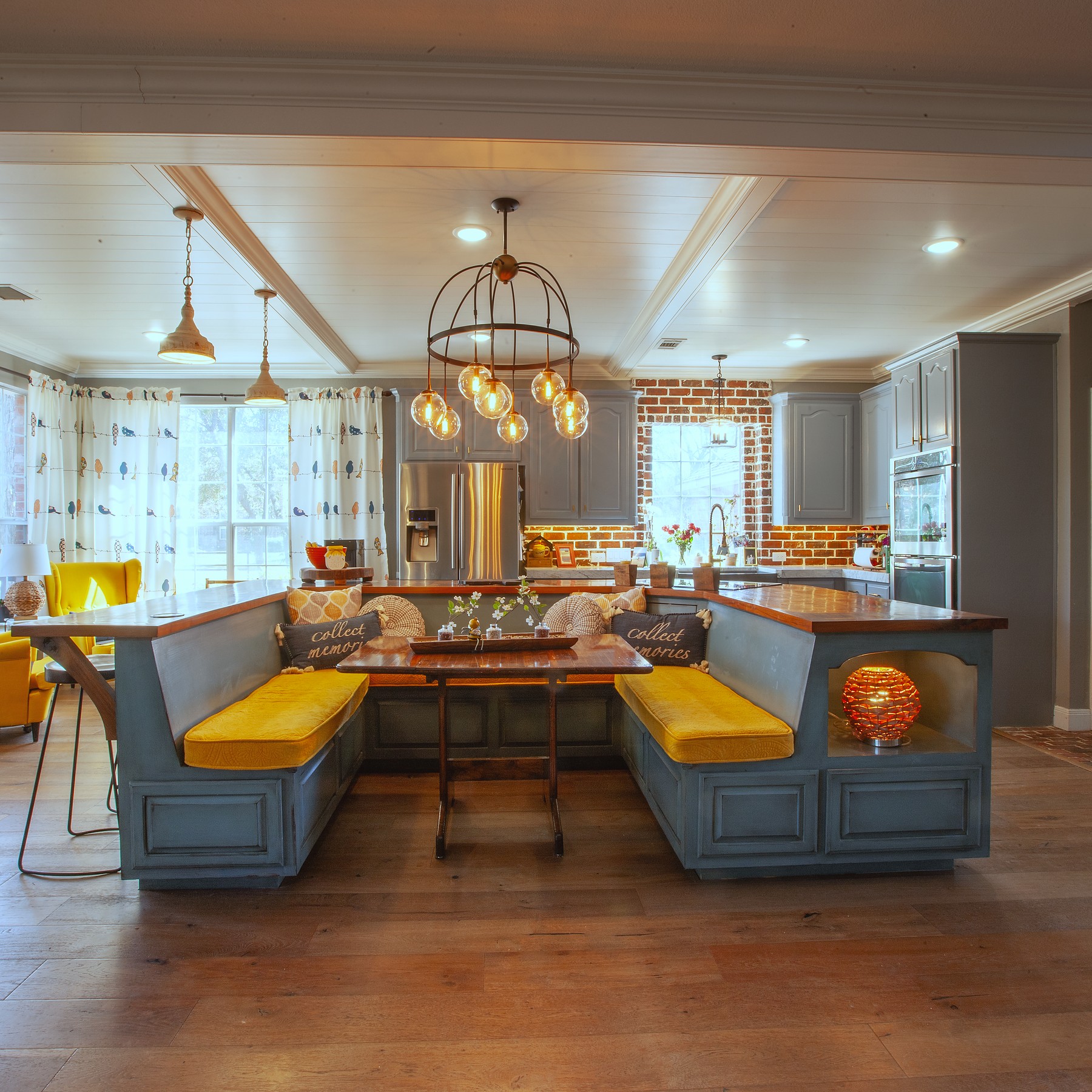 Custom kitchen with built-in banquette and pendant lighting