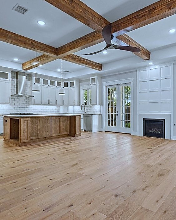 Oak Street — open kitchen with beamed ceiling and fireplace